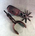 ANTIQUED PAIR OF WESTERN SPURS