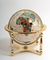 Mother of pearl globe. 4 legged stand gold. 33cm